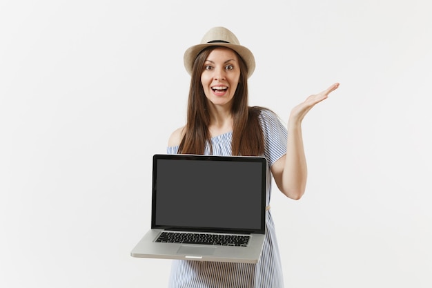 Young woman holding modern laptop pc computer with blank black empty screen to copy space isolated on white background. People freelance business, lifestyle, online shopping concept. Mobile Office.