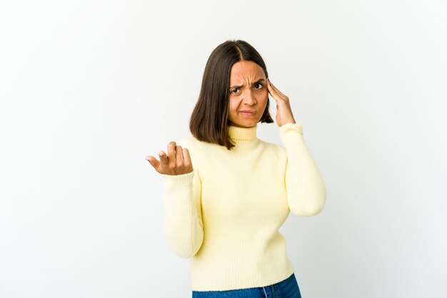 Young woman holding and showing a product on hand