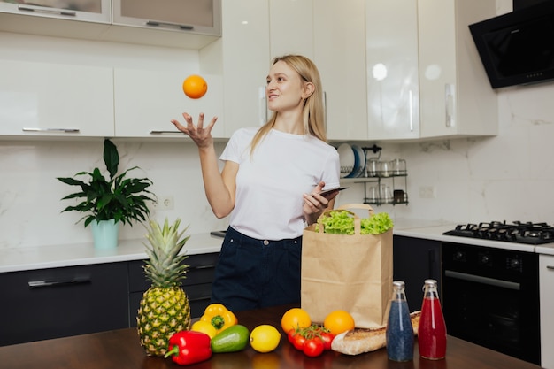 Young woman is making online shopping by phone.