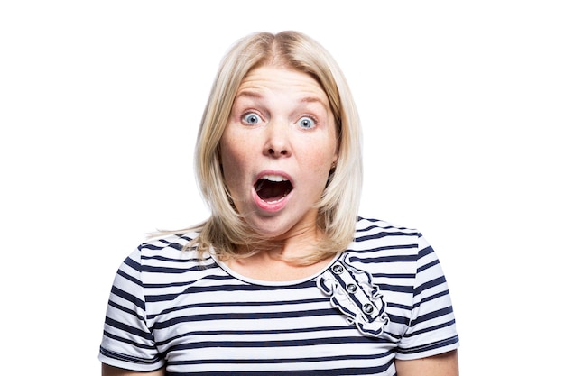 The young woman is surprised Pretty blonde woman in a striped tshirt closed up Isolated on white background