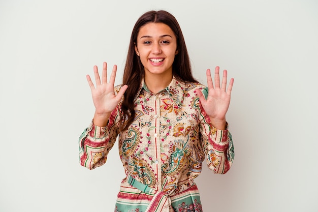 Young woman isolated on white wall showing number ten with hands