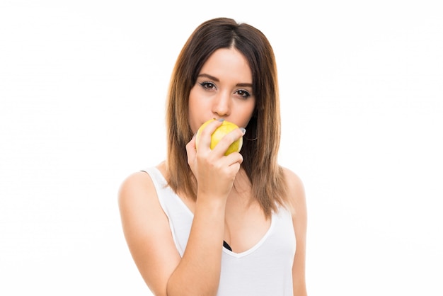 Young woman over isolated white  with an apple