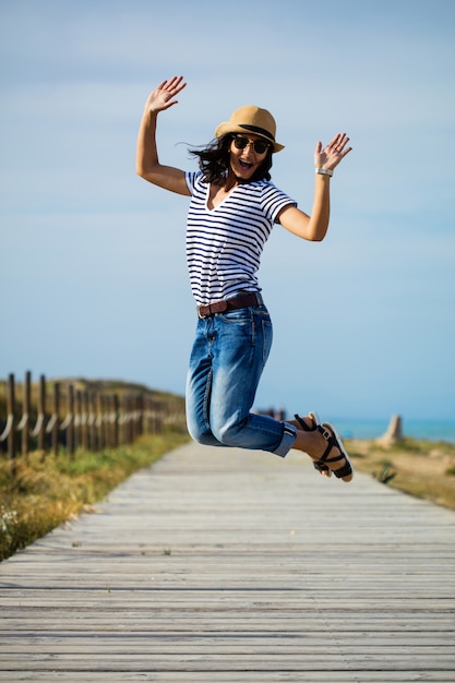 Young woman jumping in the countryside