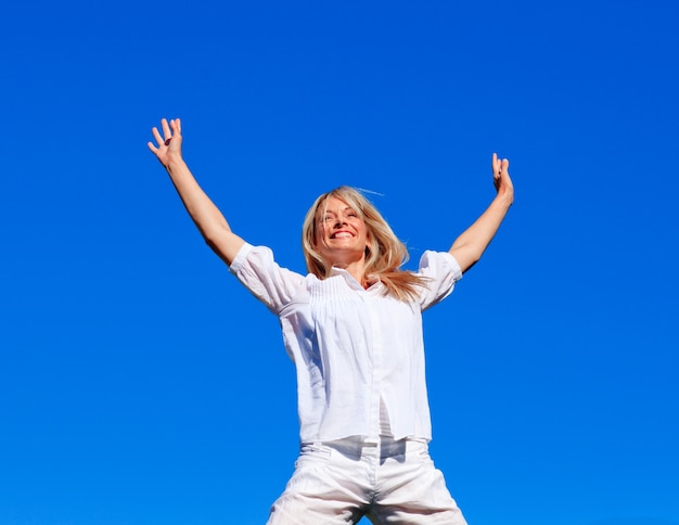 Young woman jumping outdoors