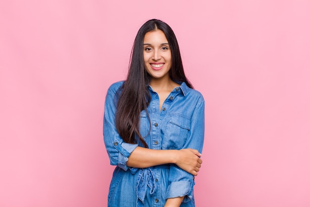 Young woman laughing shyly