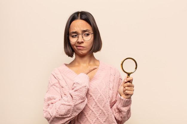 Young woman looking puzzled and confused