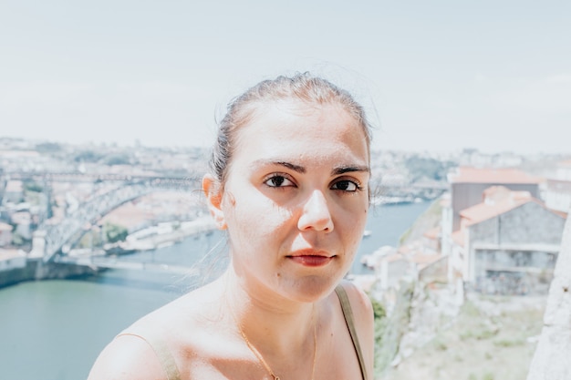 Young woman looking serious to camera during a sunny day, mental health concept