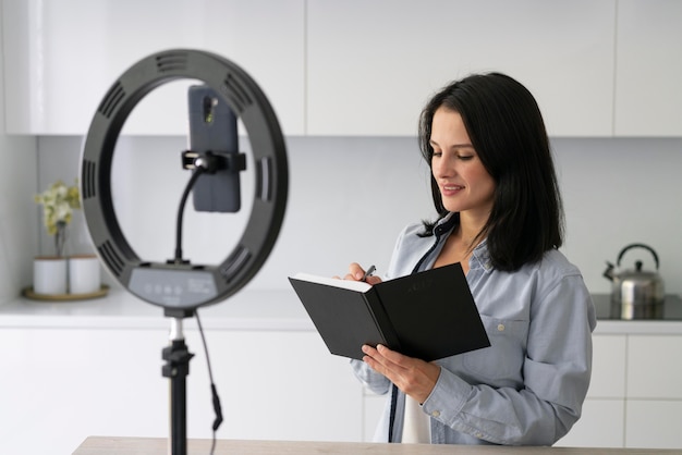 Young woman making a vlog at home