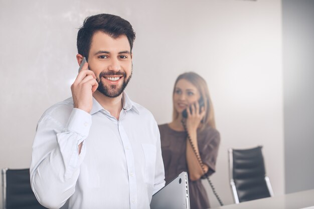 Young woman and man in the business office