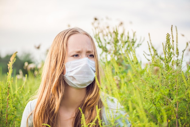 Young woman in a medical mask because of an allergy to ragweed