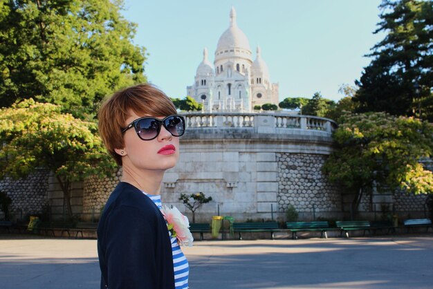 Young woman near Basilica of the Sacred Heart of Paris France