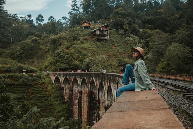 Young woman on the ninearch bridge