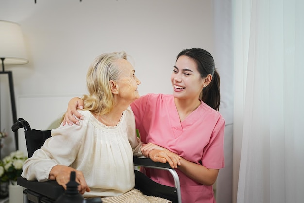 Young woman or nurse home are give support empathy to elderly or older people in assisted living homecare