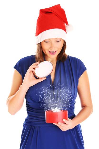 a young woman opening a christmas present over white