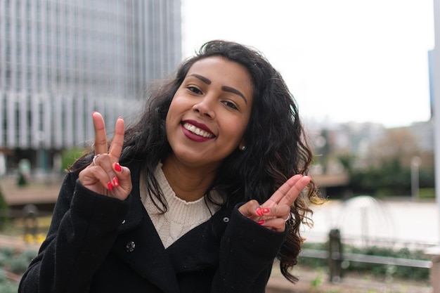 Young woman outdoors, smiling