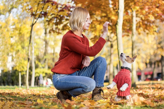 Young woman outdoors with a dog