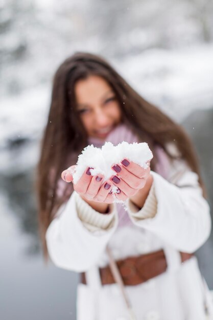 Young woman in park at winter