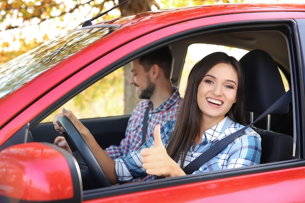 Young woman passing driving license exam