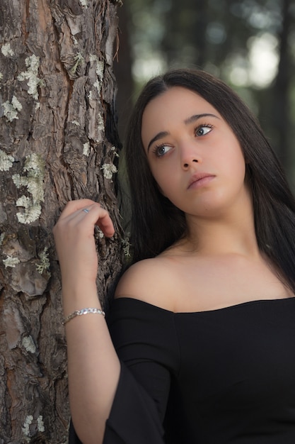 Young woman in a pine forest.