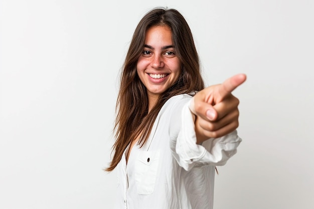 Young woman pointing front with happy expression on white isolated background