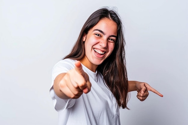 Young woman pointing front with happy expression on white isolated background