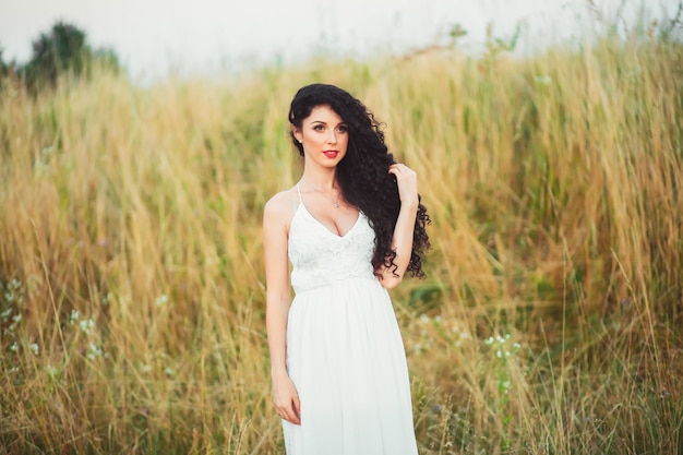 A young woman posing on a field