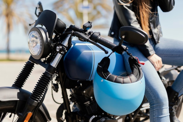 Young woman posing in a motorcycle