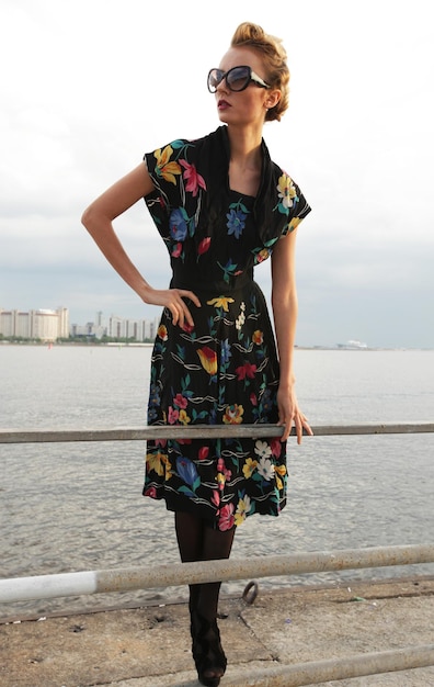 Young woman posing near the sea