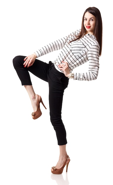 Young woman posing and smiling over white background