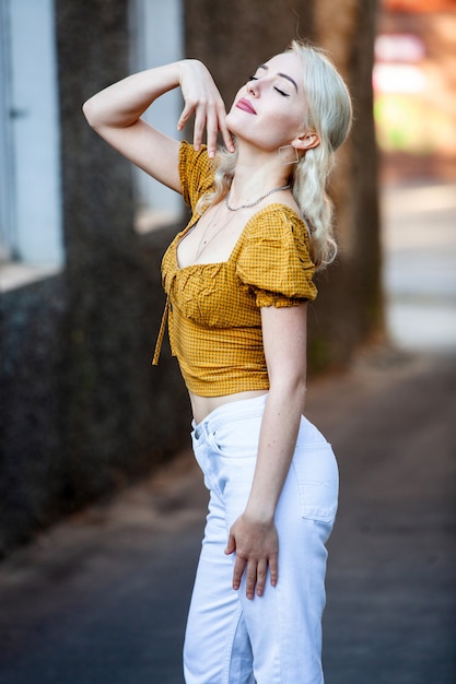 Young woman posing on the street