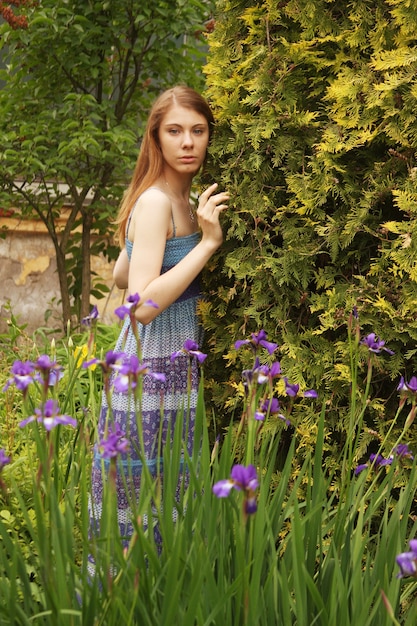 Young woman posing in summer park