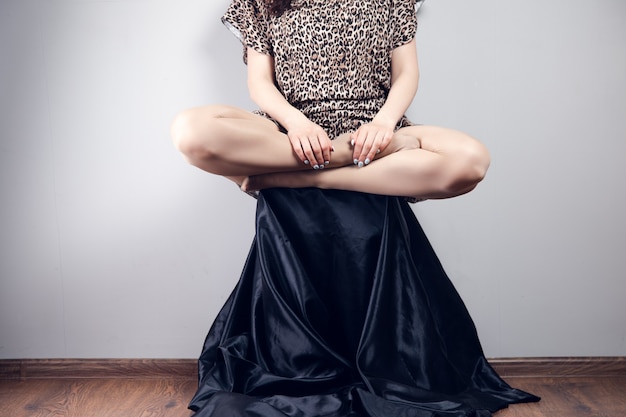 Young woman posing while sitting on a chair