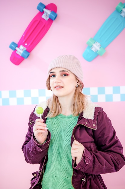 Young woman posing with lollipop