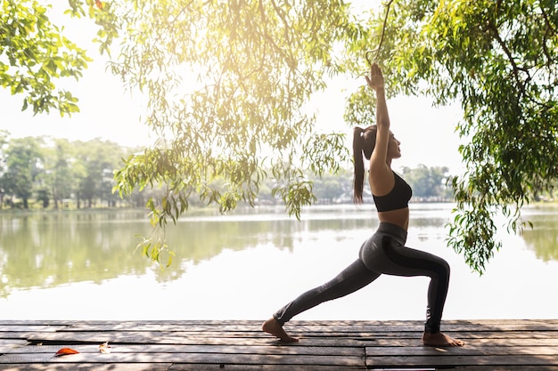 Young woman practicing yoga in the nature.female happiness