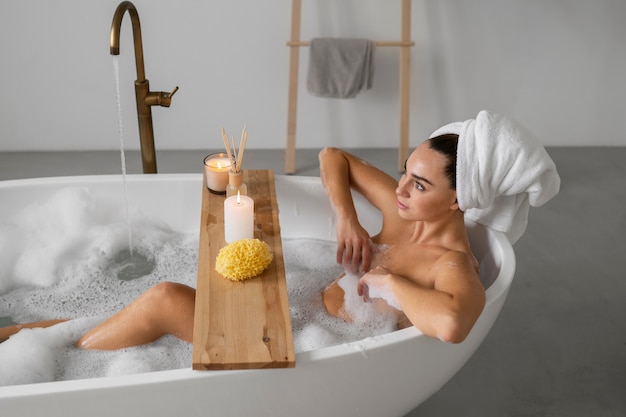 Young woman preparing for her bath time