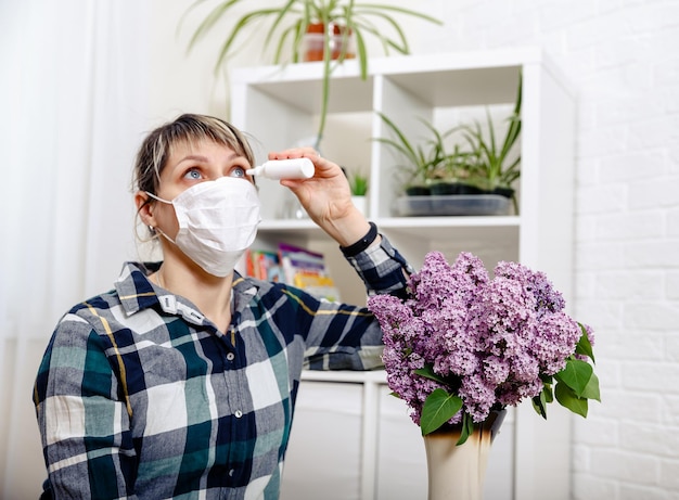 Young woman in protective sterile medical mask Pollen allergy