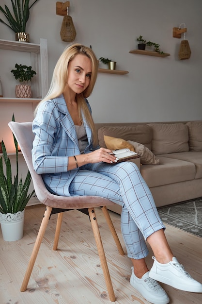 Young woman psychologist waiting for patient consultation look at camera