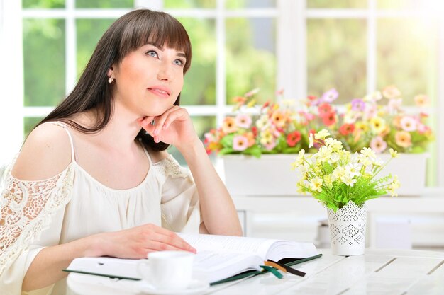 Young woman reading book