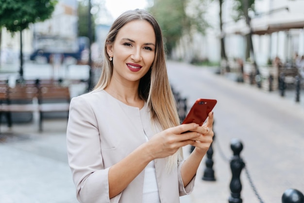 Young woman reading a message on her smartphone