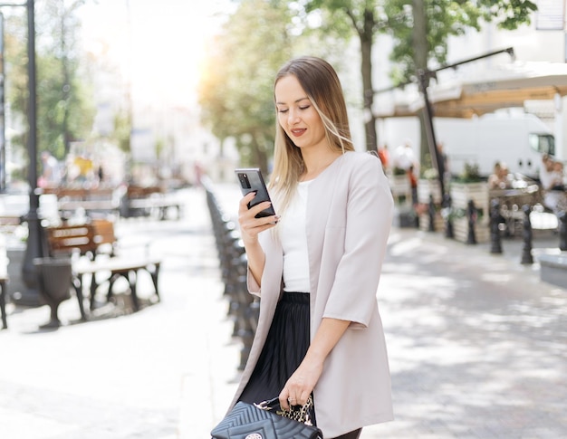 Young woman reading a message on her smartphone