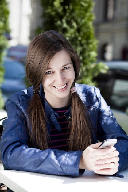 Young woman reading a message on the phone