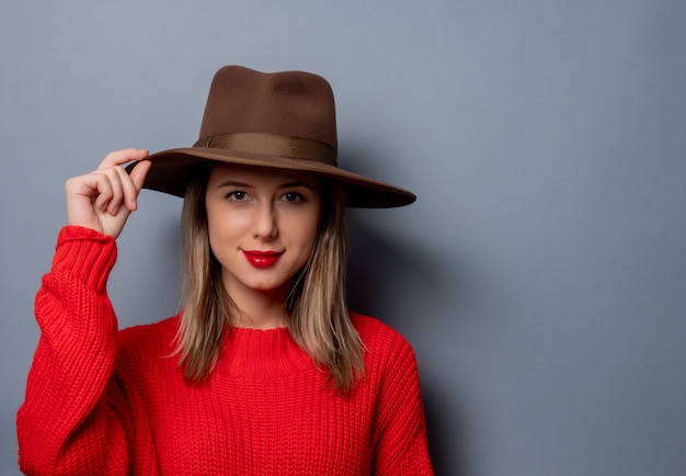  young woman in red sweater and hat