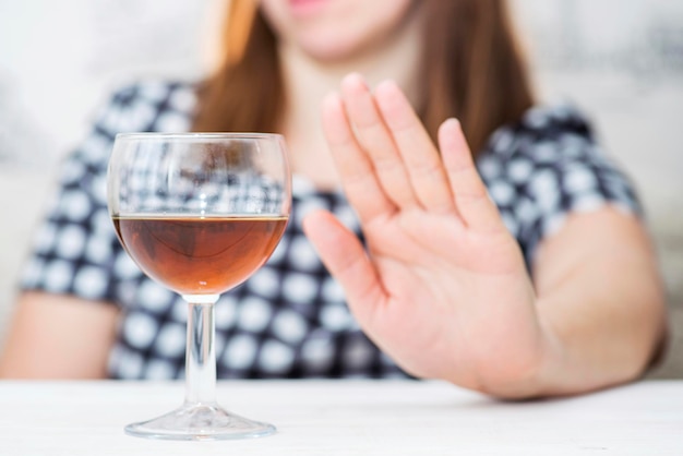 Young woman refused alcohol drink concept of alcoholism womans alcoholism