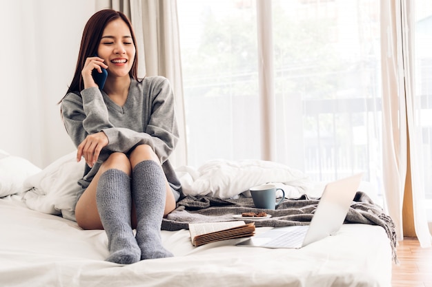 Young woman relaxing and drinking a cup of coffee