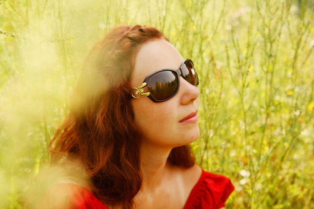 Young woman relaxing in the grass