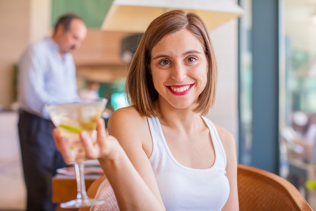 young woman in a resort with cocktail