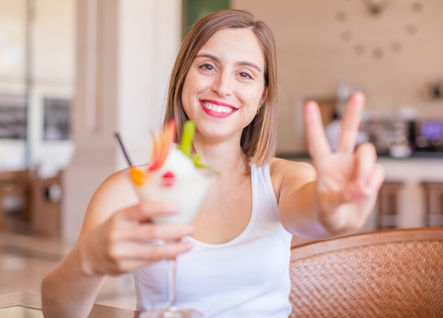 young woman in a resort with cocktail