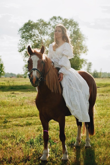 Young woman riding horse on field