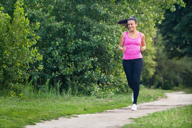 Young woman running in a park