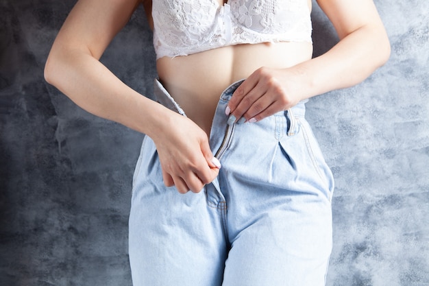 Young Woman Sexually Stands In Lingerie